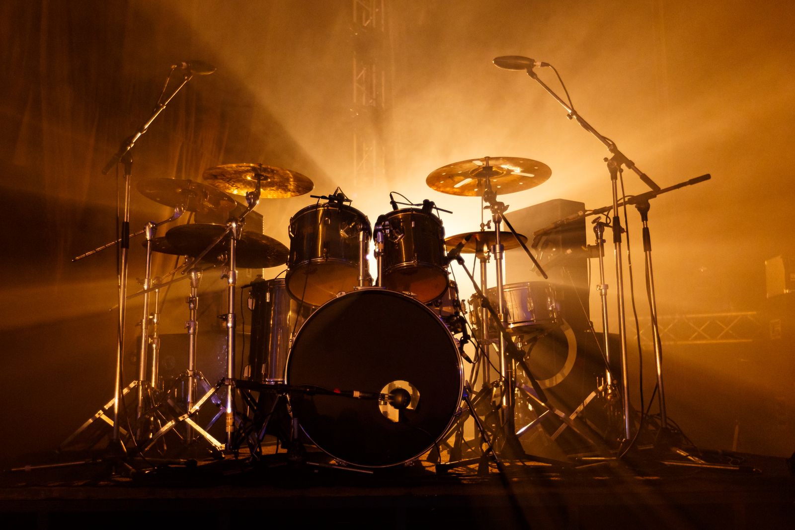 Drum kit backlit in golden haze