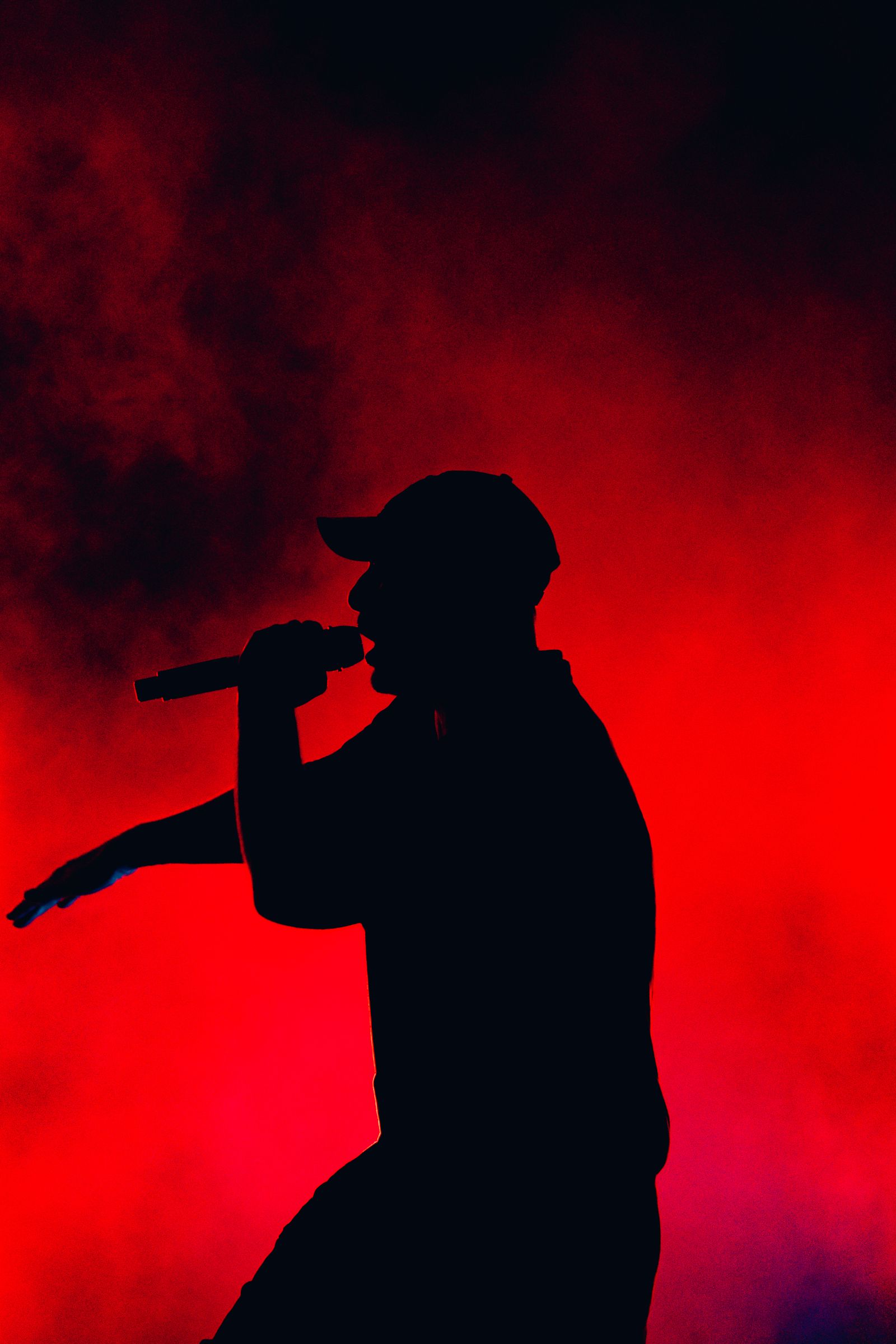 Full silhouette against red smoke