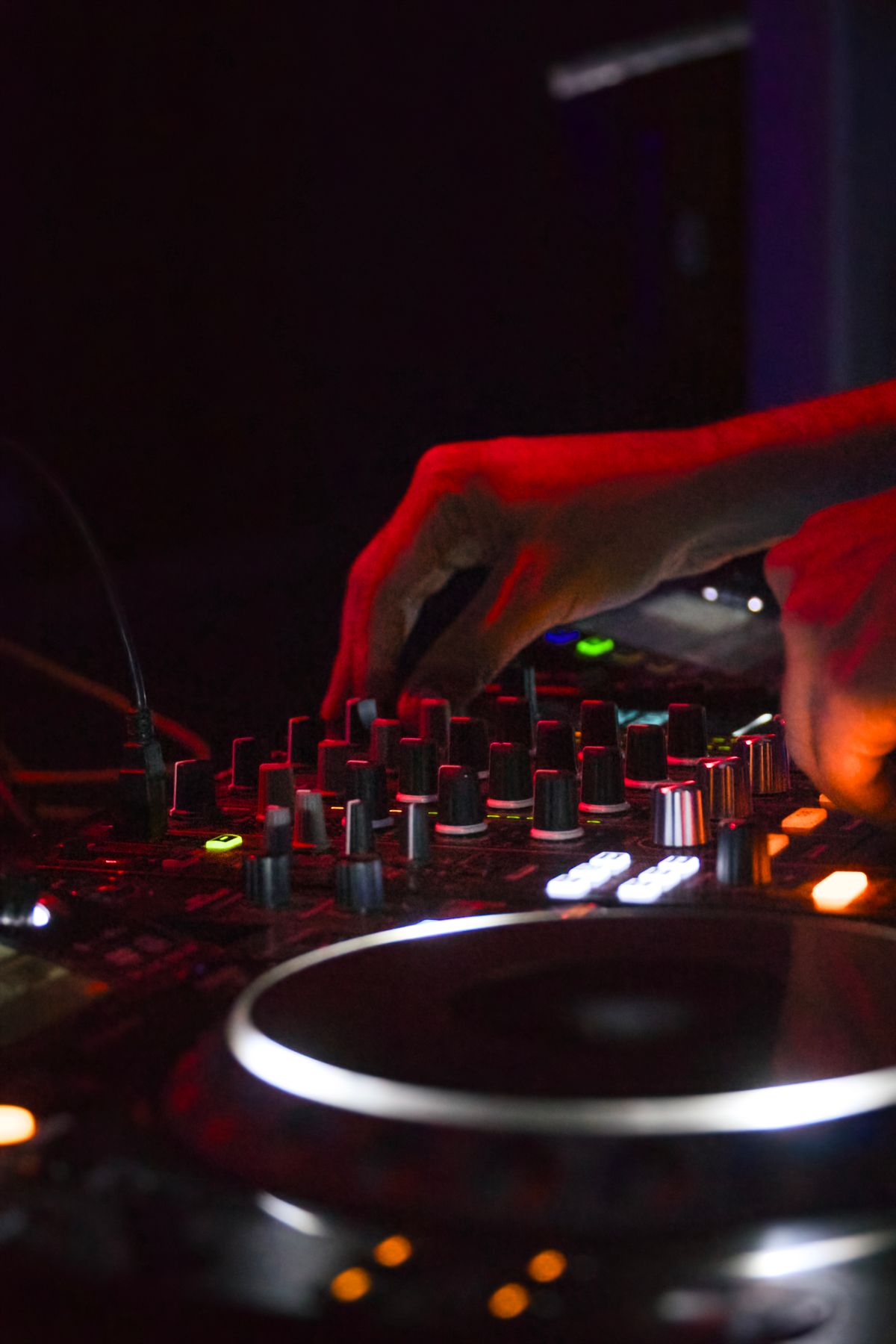 Mixing console under coloured light