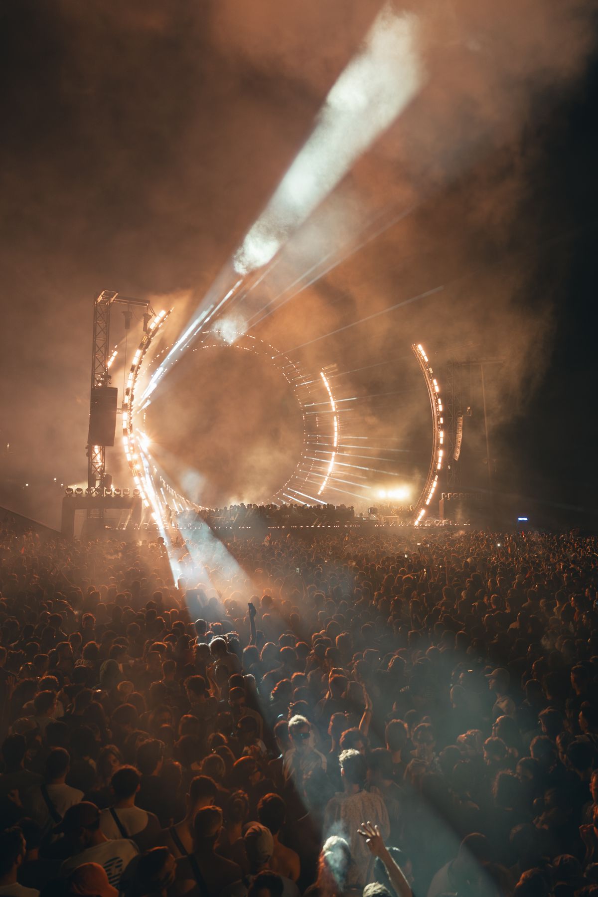Crowd dancing at a nighttime music festival